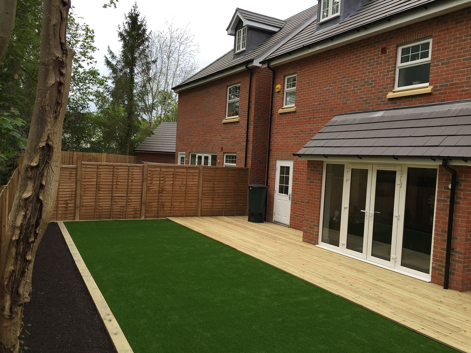 Lawn being rolled out and fitted