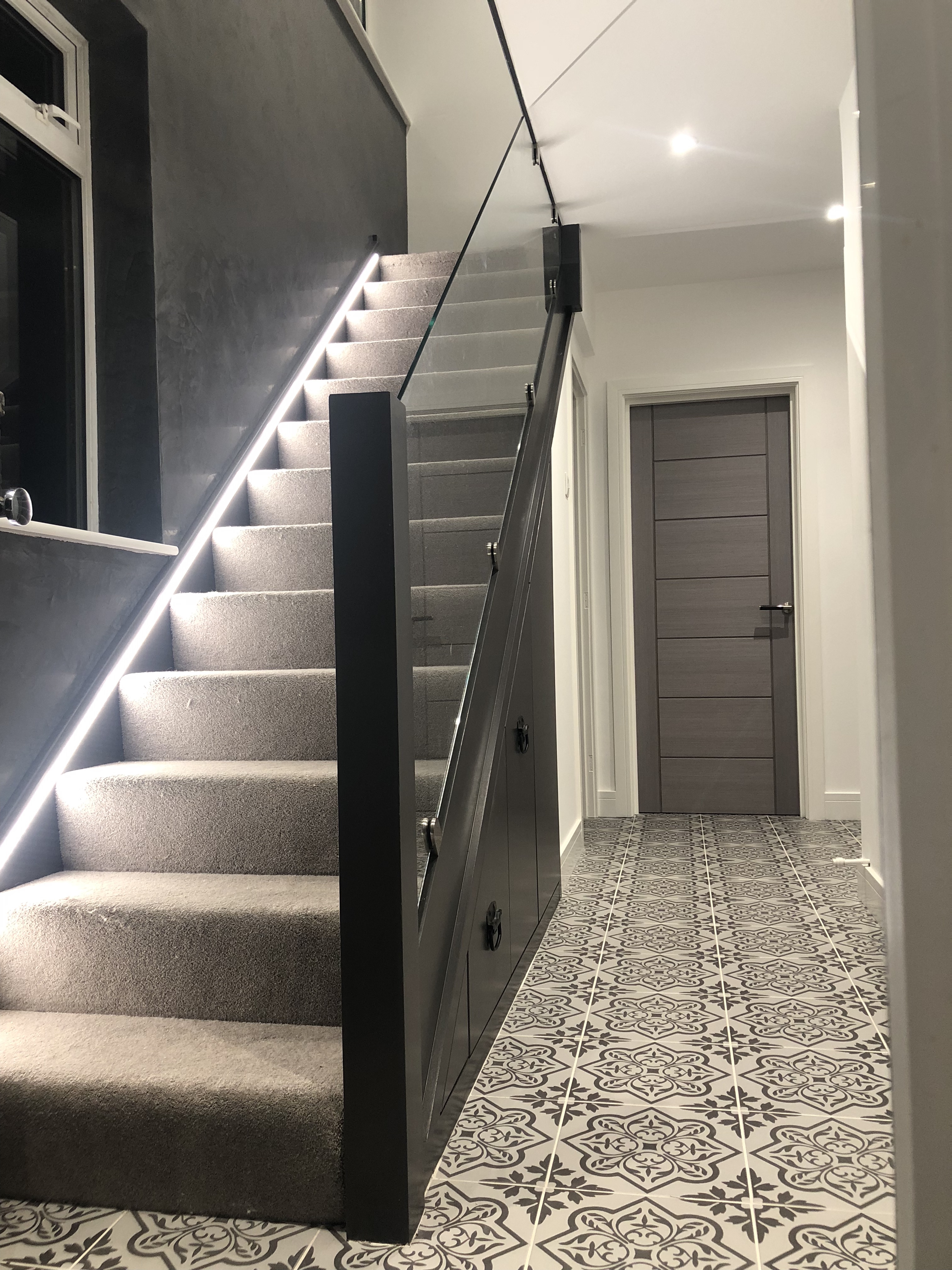 Glass balustrade detail with chrome fittings